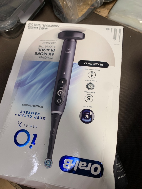 Photo 1 of ***(PARTS ONLY/ NON FUNCTIONAL)***Oral-B iO Deep Clean + Protect Rechargeable Electric Toothbrush, Black with a iO Series 7 Toothbrush, 2 Replacement Brush Heads, and a Charging Travel Case