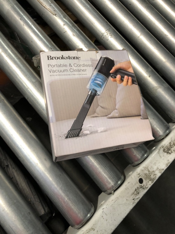 Photo 1 of ***(PARTS ONLY/ NON FUNCTIONAL)***Brookstone Small Portable Cordless Vacuum - Interchangeable Precision Heads