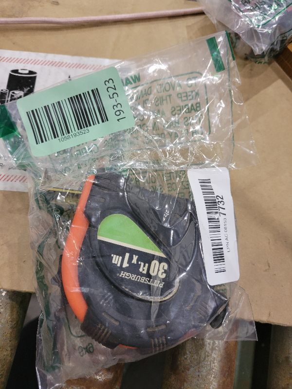 Photo 1 of 25 ft. x 1" Tape Measure Nonslip Rubber Shell Graduated in 1/16", 1/8", 1" and 1 foot stud findings