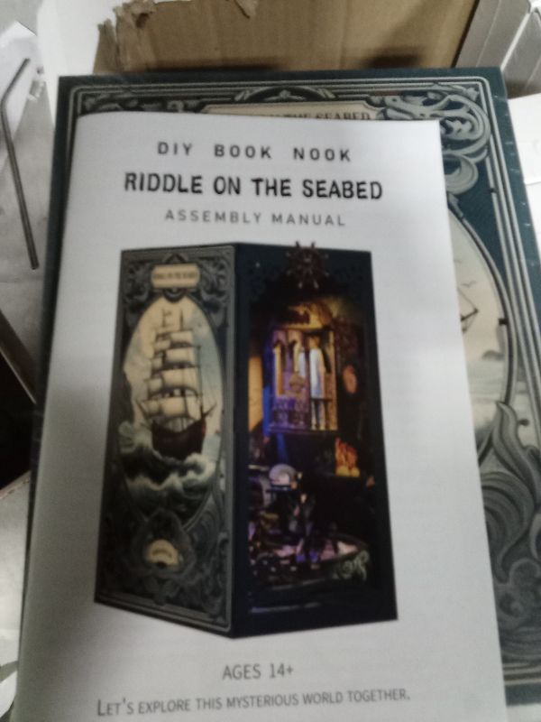Photo 1 of  Book Nook Kit, DIY Miniature Dollhouse Booknook Kit with LED Night Light and Dust Cover for Adults Teens Bookshelf Decor Gifts, for Women Teenagers Craft Lovers(Seabed Riddle)