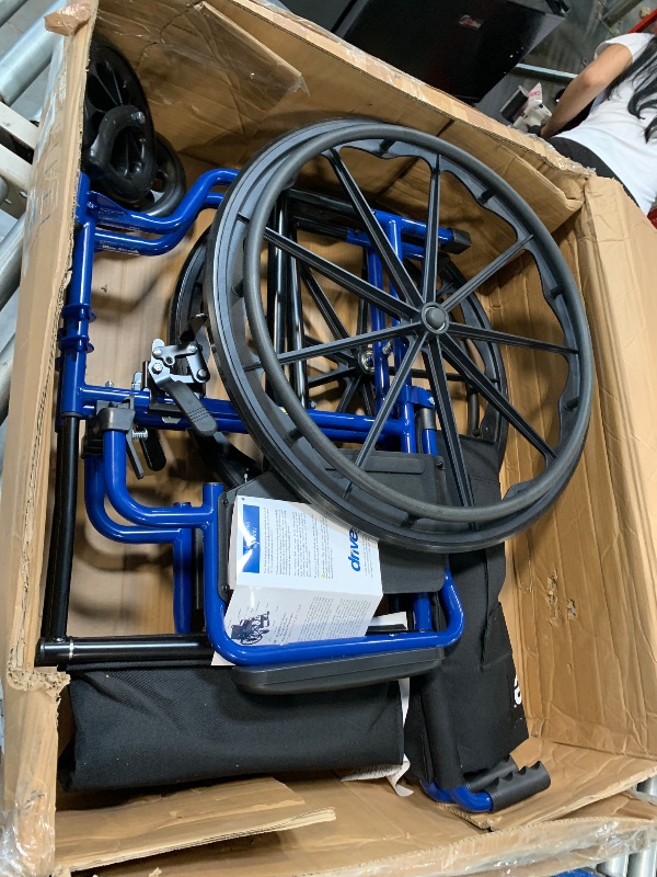 Photo 1 of ** MISSING PARTS / USED **** Drive Medical Blue Streak Lightweight Foldable Wheelchair for Adults, Seniors, and Disabled - Swing-Away Elevating Leg Rests and Flip-Back Padded Arms - Black/Blue