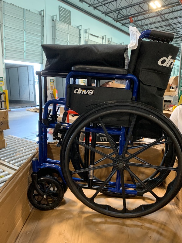 Photo 1 of ** MISSING PARTS / USED **** Drive Medical Blue Streak Lightweight Foldable Wheelchair for Adults, Seniors, and Disabled - Swing-Away Elevating Leg Rests and Flip-Back Padded Arms - Black/Blue