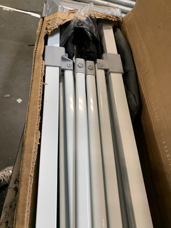 Photo 1 of ** VERY USED ** Amazon Basics Outdoor Pop Up 10 x 10 Canopy Tent for Events, Portable with Easy Setup, Includes Wheeled Carry Bag, 8 Pegs, 4 Ropes, 4 Weighted Bags, White