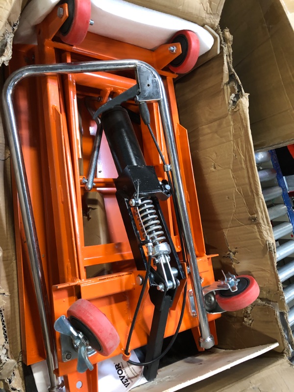 Photo 1 of ** VERY USED / UNTESTED **** VEVOR Hydraulic Lift Table Cart, 330lbs Load Capacity 50 Inch Lifting Height, Manual Single Scissor Lift Table with Non-Slip Pad and 4 Wheels, Hydraulic Scissor Cart for Material Handling, Orange