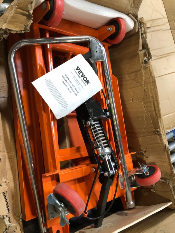 Photo 1 of ** VERY USED / UNTESTED **** VEVOR Hydraulic Lift Table Cart, 330lbs Load Capacity 50 Inch Lifting Height, Manual Single Scissor Lift Table with Non-Slip Pad and 4 Wheels, Hydraulic Scissor Cart for Material Handling, Orange