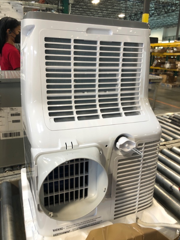 Photo 1 of ****it turns on perfectly***** BLACK+DECKER Portable Air Conditioner, 8,000 BTU (3,950 BTU SACC) for Rooms up to 400 Sq. Ft., Portable AC with Follow Me Remote Control and Window Kit, BPACT08WT, White