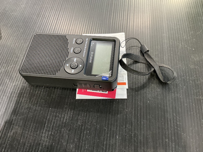 Photo 1 of Ratakee AM/FM Radio, Battery Operated Portable Radio with Clock, Preset, Sleep Timer and Battery Backup for Yard Work, Walking, Camping, Jogging, Fishing, Handheld Size, 3 AA Battery Powered (Black)