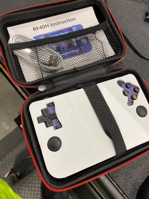 Photo 1 of **UNTESTED**
RF40H Handheld Game Console, 4.0" Retro Gaming Console Preloaded 20,000+ Classic Games, Open Source Linux System, Support WiFi Online Play, Portable Pocket Hand Held Video Game (Transparent Purple)