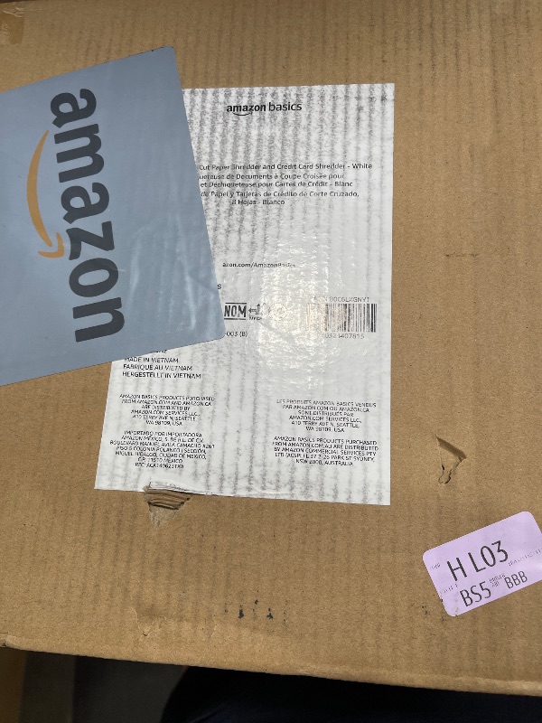 Photo 1 of Amazon Basics Cross Cut Paper and Credit Card Shredder for Security - 8-Sheet, Heavy Duty, White