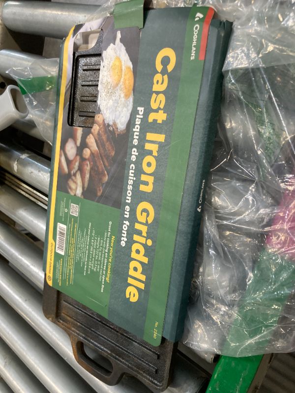 Photo 1 of ****STAINED***Coghlan's Cast Iron Griddle – Reversible Pre-Seasoned Camping Cookware for Grilling, Frying, and Outdoor Cooking – Durable and Versatile Skillet Pan, 18 x 9 Inches