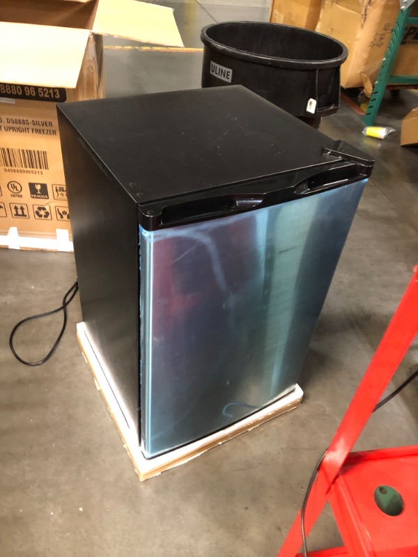 Photo 1 of ***DAMAGED - DENTED - POWERS ON - UNABLE TO TEST FURTHER - SEE PICTURES***
3.0 Cu.ft Upright Freezer, Small Mini Freezer with Adjustable Thermostat, Removable Shelves, Reversible Single Door, for Bedroom/Home/Dorms/Apartment, Silver