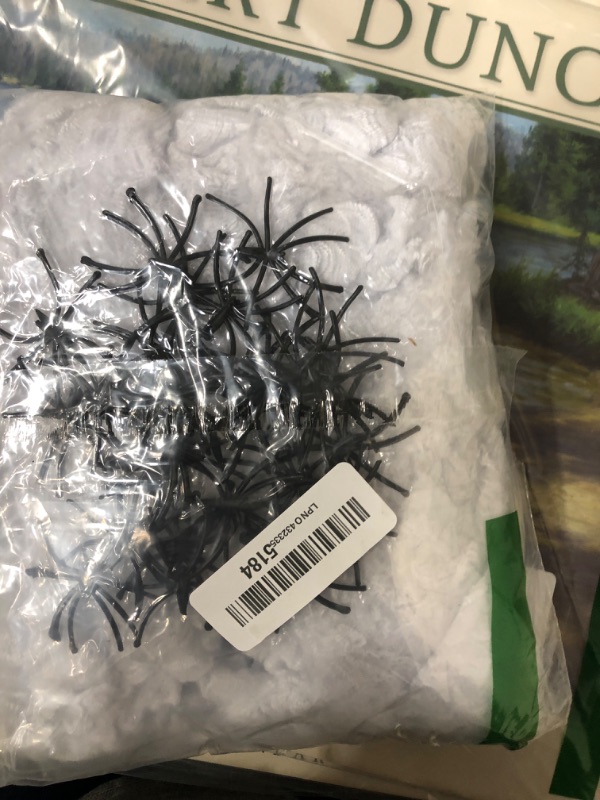 Photo 1 of 1000 sqft Spider Webs Halloween Decorations Bonus with 30 Fake Spiders, Super Stretch Cobwebs for Halloween Indoor and Outdoor Party Supplies