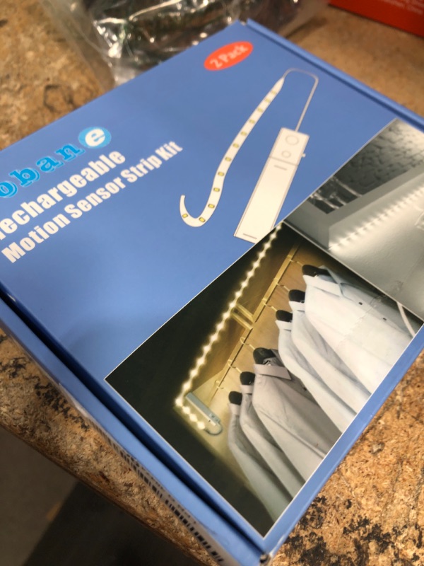 Photo 1 of **POSSIBLY FOR PARTS CHARGER CONTROLS NON-FUNCTIONAL** WOBANE Motion Sensor Stair Strip Lights,Rechargeable Motion Activated Closet Light,Battery Powered LED Strip,60 LEDs Homelife Bar for Bed,Pantry,Counter,Night Light,Cabinet,6000K White,6.56ft,2PCS