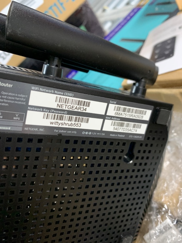 Photo 1 of ***(HEAVILY USED/ MINOR DAMAGE/ UNABLE TO TEST ITEM)***NETGEAR 4-Stream WiFi 6 Router (R6700AX) – Security Features, AX1800 Wireless Speed (Up to 1.8 Gbps), Covers up to 1,500 sq. ft., 20 Devices