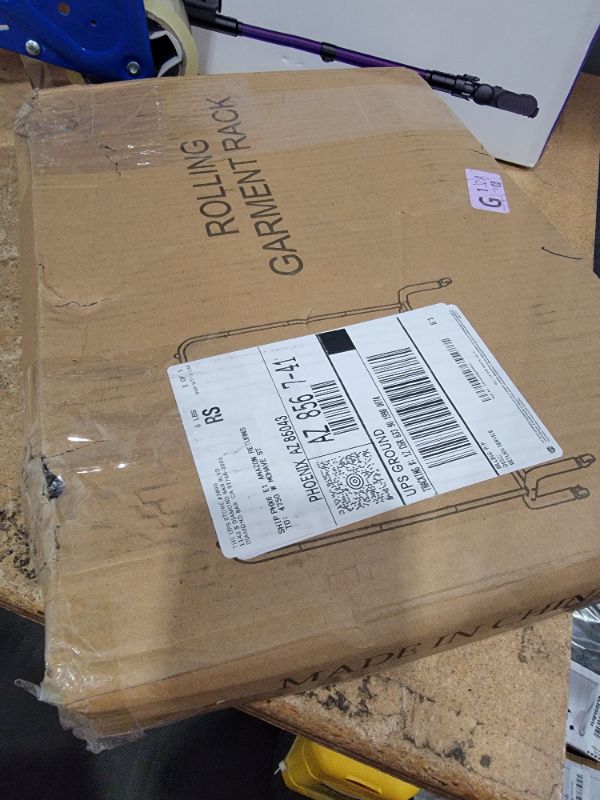 Photo 1 of **POSSIBLY FOR PARTS/ STAND NOT STABLE** JIUYOTREE Metal Clothing Rack with Wheels, 43.3 Inches Rolling Clothes Garment Coat Rack with Bottom Shelf, Clothing Rack for Hanging Clothes, Coats, Skirts, Shirts, Sweaters, Black