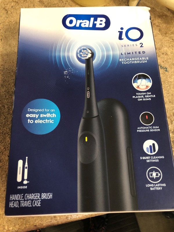 Photo 1 of Oral-B iO Simple Clean Rechargeable Electric Powered Toothbrush, Night Black with 1 Gentle Care Brush Head and 1 Black Travel Case - Automatic Pressure Sensor to Protect Gums - 3 Modes - 2 Min Timer