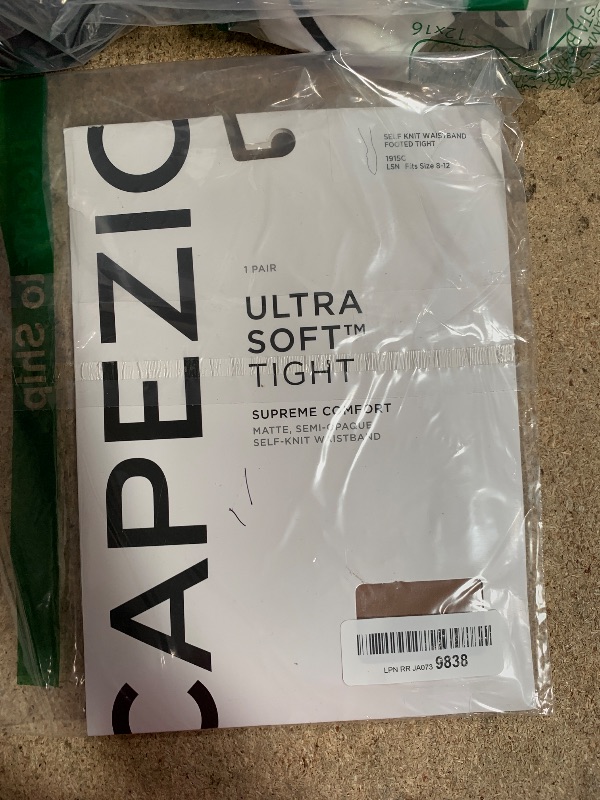 Photo 1 of Capezio Big Girls' Ultra Soft Self Knit Waistband Footed Tight, Light Suntan, One Size (Child 8-12)