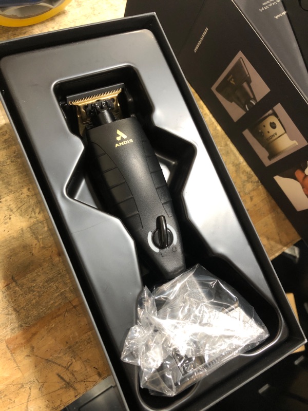 Photo 1 of **FOR PARTS/NON-FUNCTIONAL** Andis 74150 GTX-EXO Professional Cord/Cordless Lithium-ion Electric Beard & Hair Trimmer with Charging Stand, Black