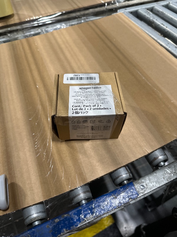 Photo 1 of Amazon Basics LED Puck Lights, Color Changing, Battery Operated, IR Remote, 40 Lumens, 2 Pack, Wireless Stick on Lights, Under Cabinet Lighting, Ideal for Closets, and More, White