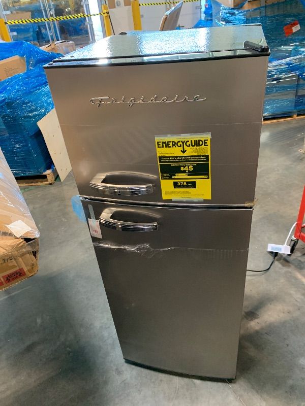 Photo 1 of ** wobbly, uneven footing**
Frigidaire EFR753, 2 Door Apartment Size Refrigerator with Freezer, Retro Chrome Handle, 7.5 cu ft, Platinum Series, Stainless steel, 7.5