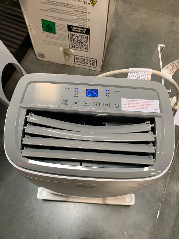 Photo 1 of ** BROKEN VENTS BLADES**
BLACK+DECKER Portable Air Conditioner, 9,000 BTU (5,300 BTU SACC) for Rooms up to 400 Sq. Ft., Portable AC with Follow Me Remote Control and Window Kit, BPACT08WT, White