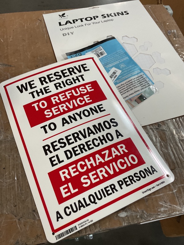 Photo 1 of "We Reserve The Right to Refuse Service to Anyone" Bilingual Sign by SmartSign | 10" x 14" Plastic