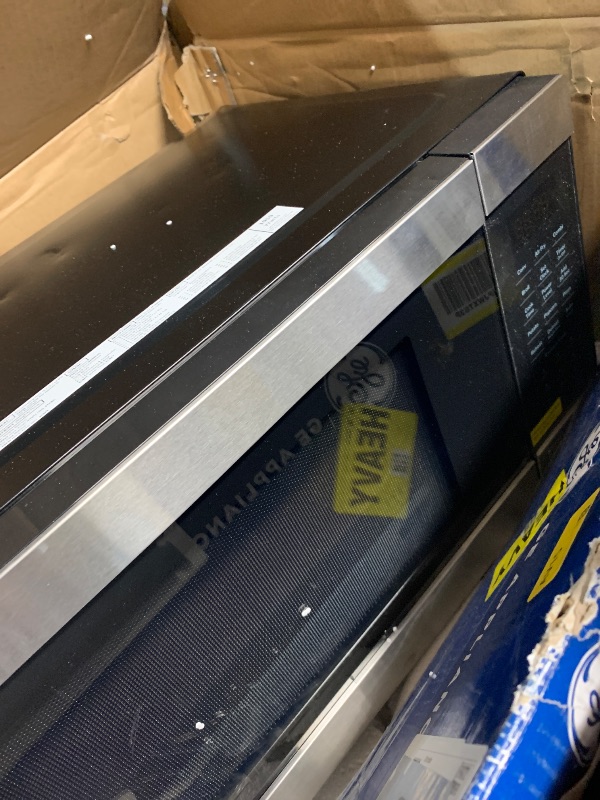 Photo 1 of (used)(please see all images) GE GCST10A1WSS 4-in-1 Microwave Oven, 1,050 Watts Air Fryer, Broiler & Convection Mode, Child-Lock Technology