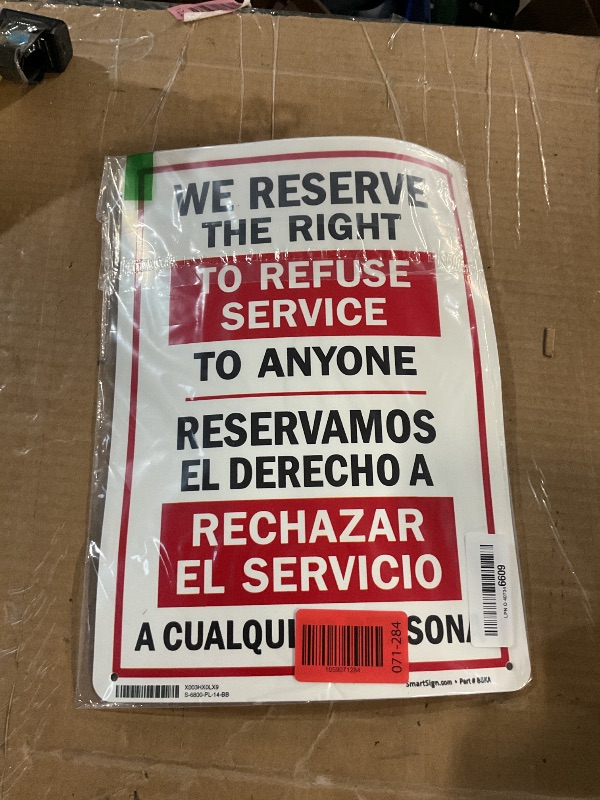 Photo 1 of "We Reserve The Right to Refuse Service to Anyone" Bilingual Sign by SmartSign | 10" x 14" Plastic