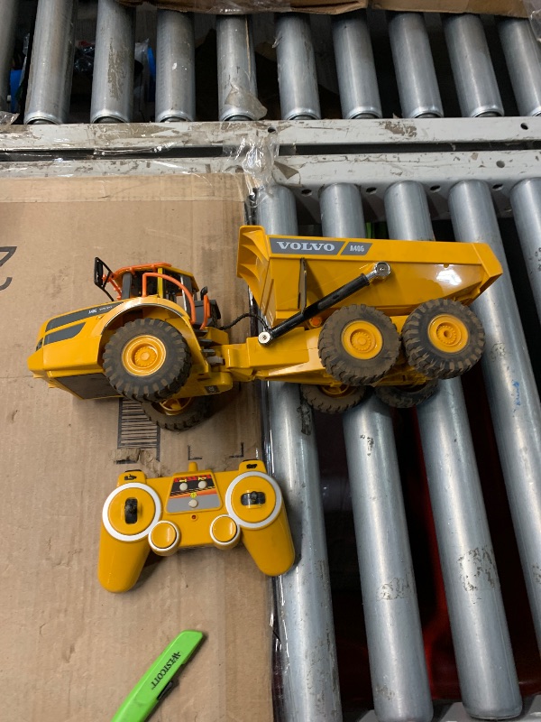 Photo 1 of (HEAVILY USED) (MISSING BATTERY/CHARGER) DOUBLE E Volvo RC Dump Truck Toy for Kids, Articulated Hauler, Remote Control Construction Toys Vehicles with Lights, Birthday Gifts Ideas for Boys Age 6 7 8 9 10 Year Old and up