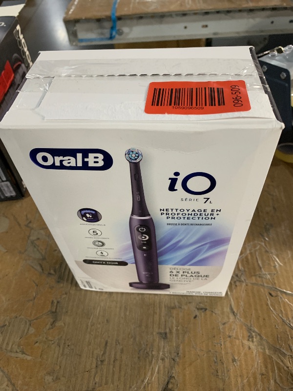 Photo 1 of Oral-B iO Deep Clean + Protect Rechargeable Electric Toothbrush, Black with a iO Series 7 Toothbrush, 2 Replacement Brush Heads, and a Charging Travel Case