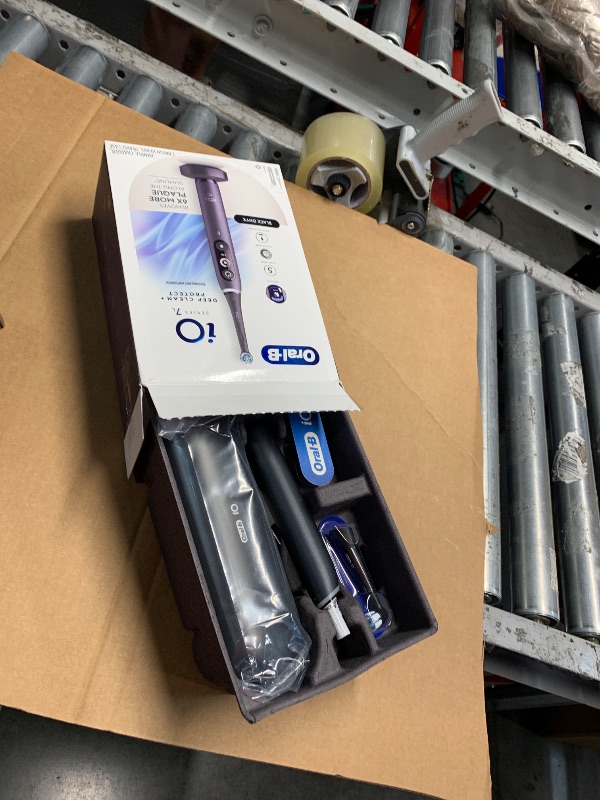 Photo 1 of Oral-B iO Deep Clean + Protect Rechargeable Electric Toothbrush, Black with a iO Series 7 Toothbrush, 2 Replacement Brush Heads, and a Charging Travel Case