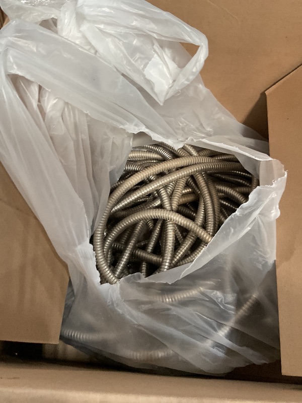 Photo 1 of 100Ft Metal Garden Hose durable stainless steel Water Hose, flexible, lightweight hose is resistant to kinks and tangles.With 10-way nozzle, strong 3/4” metal fittings, and a shut-off valve.