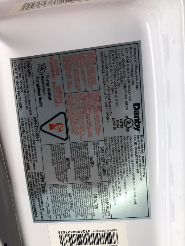 Photo 1 of ***DAMAGED - DENTED - POWERS ON - UNABLE TO TEST FURTHER - SEE PICTURES***
Danby DBMW0721BWW 0.7 cu. ft White Countertop Microwave