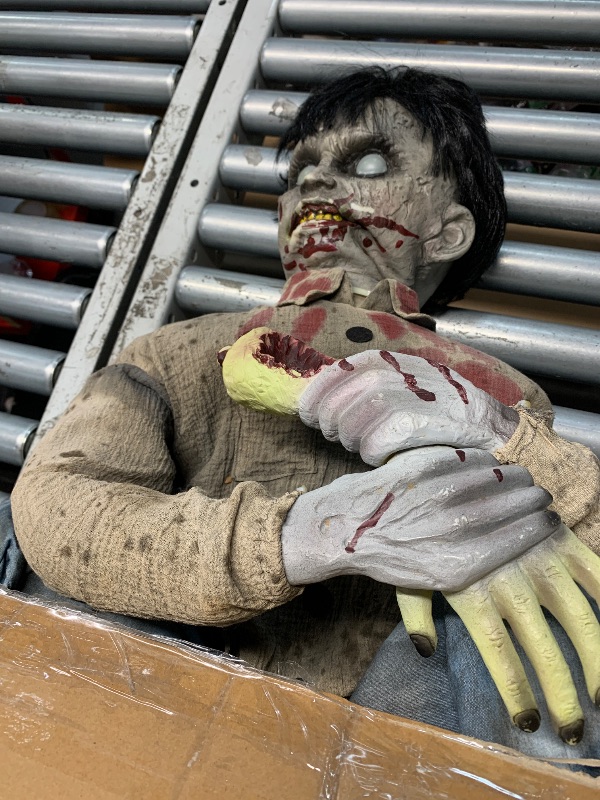 Photo 1 of (used)(see all images) Haunted Hill Farm Crouching Limb Eater Zombie Boy by Tekky, Motion-Activated Halloween Animatronics for Indoor 