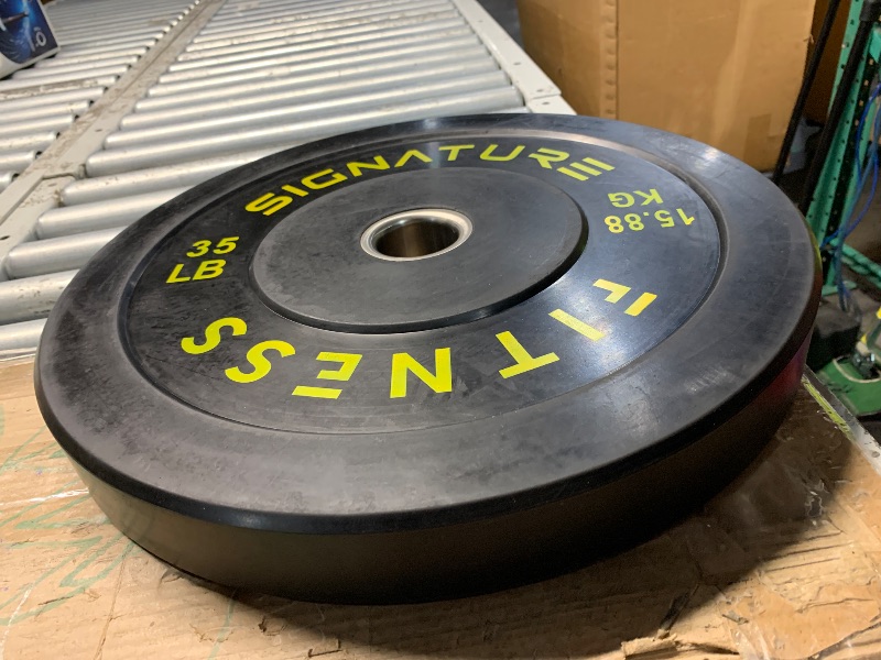 Photo 1 of ***(HEAVILY USED/ MINOR SCRATCHES)***Signature Fitness 2" Olympic Bumper Plate Weight Plates with Steel Hub, 35LB, Single, Black