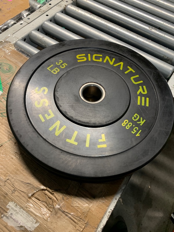 Photo 1 of ***(HEAVILY USED/ MINOR SCRATCHES)***Signature Fitness 2" Olympic Bumper Plate Weight Plates with Steel Hub, 35LB, Single, Black