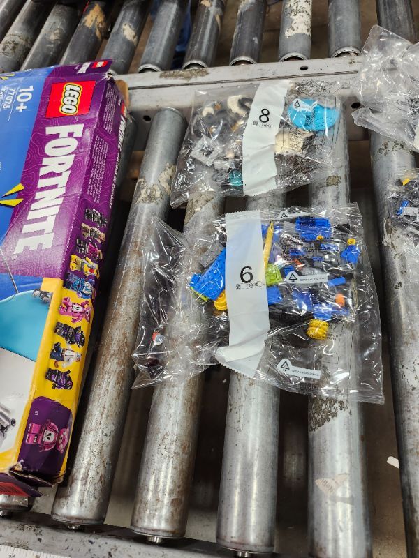 Photo 1 of **********ALL BAGS STILL SEALED, MISSING INSTRUCTIONS***************
LEGO Fortnite Battle Bus - Collectible Fortnite Toy for Kids, Boys and Girls, Ages 10+ - Pretend Play Set with 9 Minifigures from Video Game - Gift Ideas for Fans - 77073