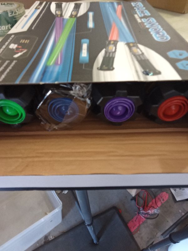 Photo 1 of 4 Pack  Sword Saber with FX Sound (on-Off Control) and Full Retractable Handle, 4 Colors LED Glow in The Dark Toy for Kids Adult