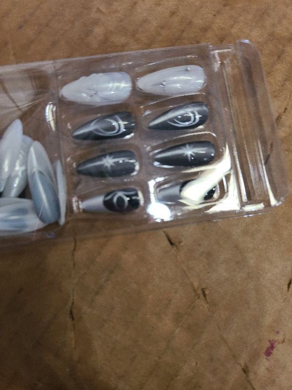 Photo 1 of 24Pcs Black Press on Nails Almond Medium Fake Nails Silver Chrome Artificial Acrylic Nails Y2K Star Full Cover Stick on Nails 3D Alloy Gothic False Nails Black Heart Glue on Nails for Women Manicure