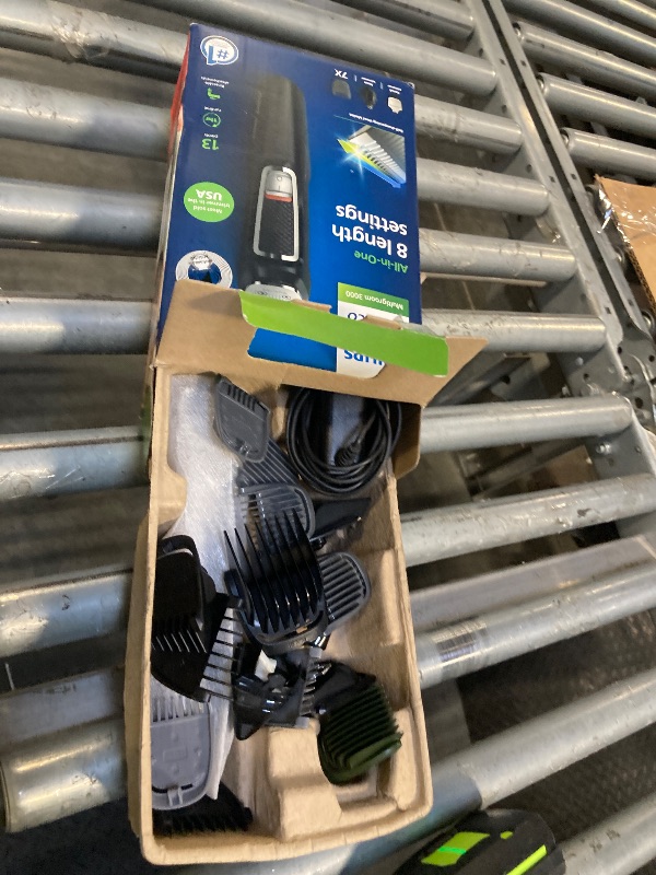 Photo 1 of **DAMAGE**Norelco Philips Multi Groomer - 13 Piece Mens Grooming Kit for Beard, face, Nose, and Ear Hair Trimmer and Hair Clipper - NO Blade Oil Needed, MG3740/40