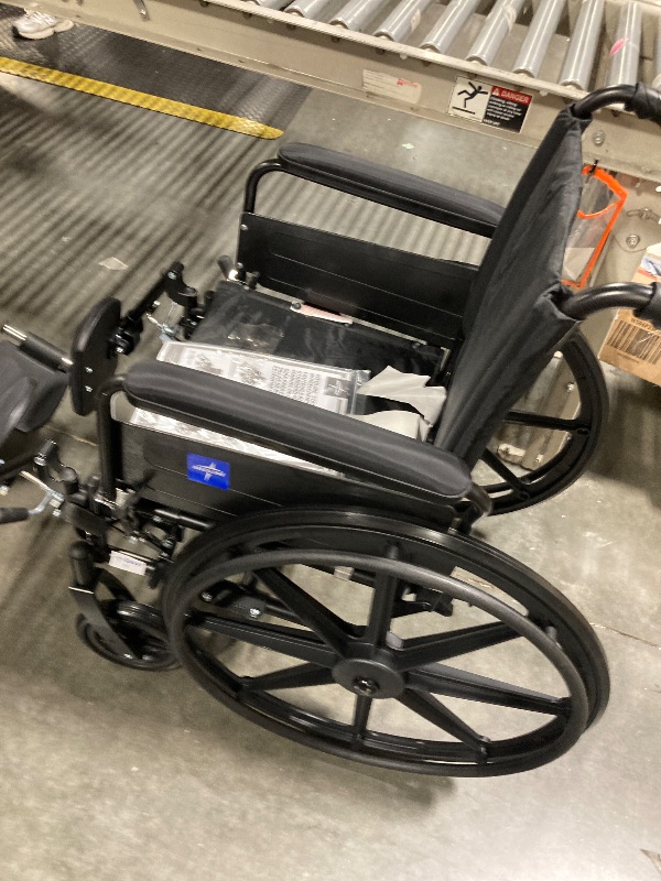 Photo 1 of ** INCLUDED MANUAL / UNPACKAGED ** Medline Premium UltraLightweight Wheelchair with FullLength FlipBack Arms and Elevating Leg Rests for Extra Comfort 18” Seat, No, 1 Count
