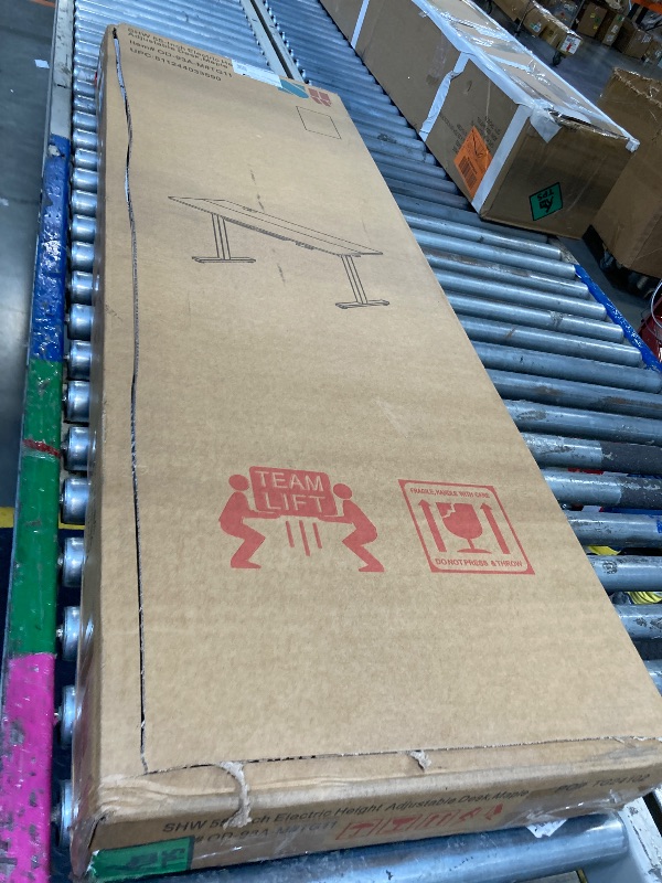 Photo 1 of ** BRAND NEW ITEM ** SHW 55 x 28 Inches Electric Height Adjustable Standing Desk with Drawer and Memory Preset, Maple