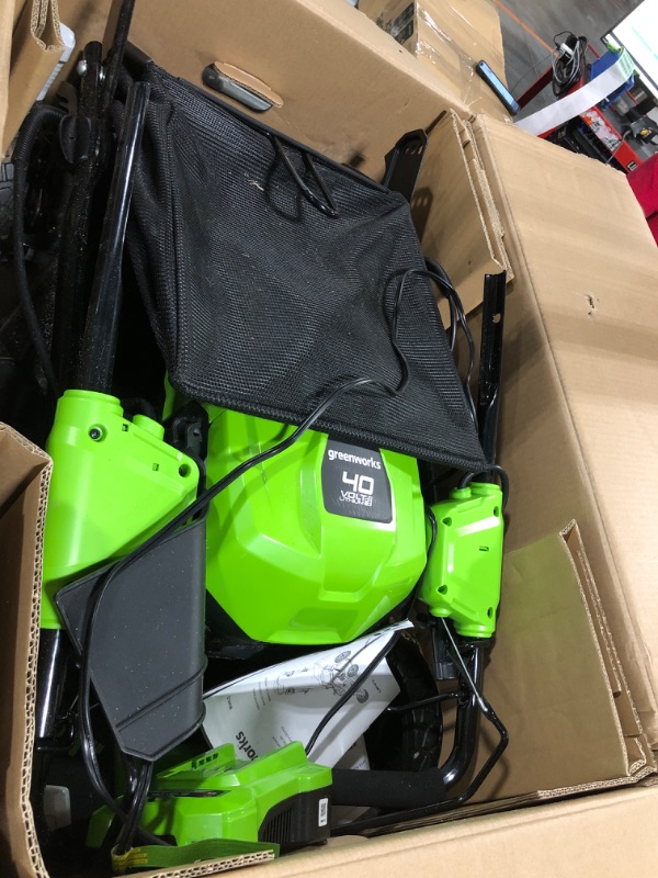 Photo 1 of ** VERY USED / THE BATTERY TURNS ON ** Greenworks 40V 21" Brushless Cordless (Self-Propelled) Lawn Mower (75+ Compatible Tools), 5.0Ah Battery and Charger Included