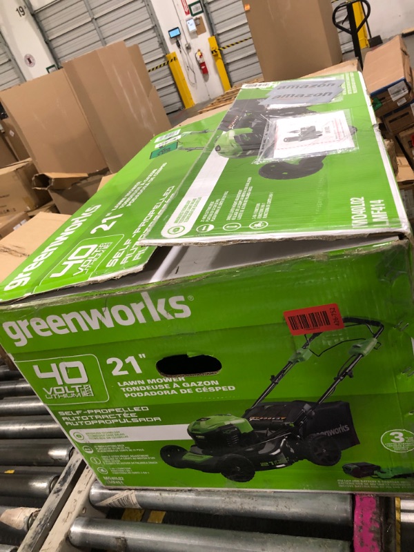 Photo 1 of ** VERY USED / THE BATTERY TURNS ON ** Greenworks 40V 21" Brushless Cordless (Self-Propelled) Lawn Mower (75+ Compatible Tools), 5.0Ah Battery and Charger Included