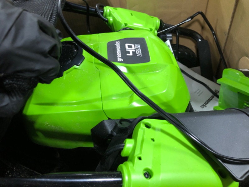 Photo 1 of ** VERY USED / THE BATTERY TURNS ON ** Greenworks 40V 21" Brushless Cordless (Self-Propelled) Lawn Mower (75+ Compatible Tools), 5.0Ah Battery and Charger Included