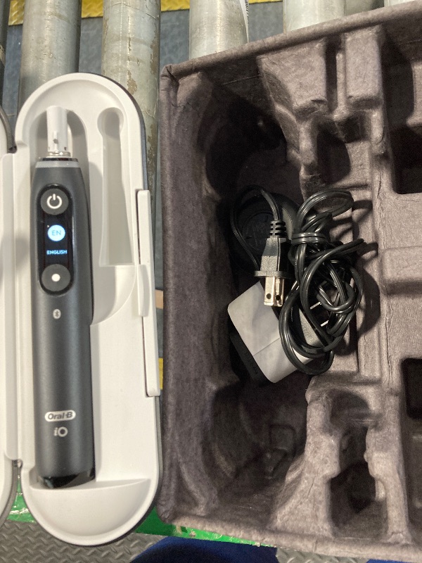 Photo 1 of ***MISSING PARTS***
Oral-B iO Deep Clean + Protect Rechargeable Electric Toothbrush, Black with a iO Series 7 Toothbrush, 2 Replacement Brush Heads, and a Charging Travel Case