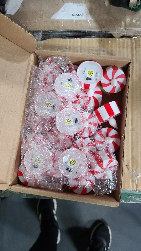 Photo 1 of 24 Pcs Christmas Candy Cane Tea Lights LED Flameless Candles Striped Battery Operated Flickering Candles Warm Yellow Light Flameless Tealight for Christmas Party(Red)