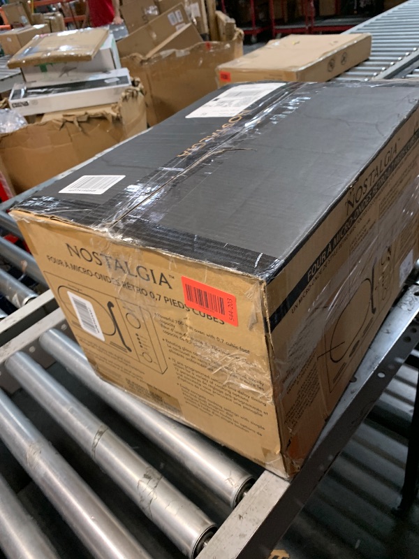 Photo 1 of ***FOR PARTS ONLY ***MAJOR DAMAGE***
Nostalgia Retro Compact Countertop Microwave Oven - 0.7 Cu. Ft. - 700-Watts with LED Digital Display - Child Lock - Easy Clean Interior - White