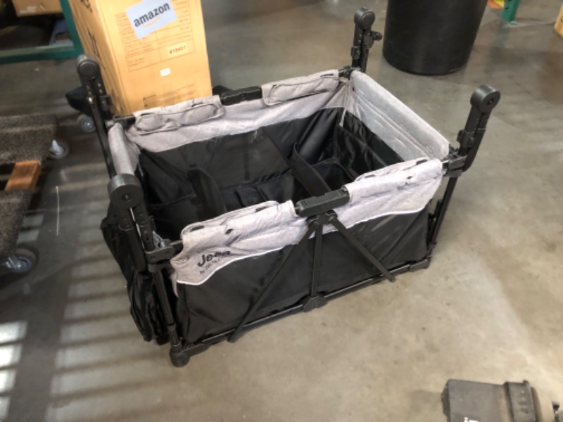 Photo 1 of ***INCOMPLETE - MISSING ALL ACCESSORIES - NO WHEELS, CANOPY, OR OTHER PARTS - SEE PICTURES***
Jeep Wrangler Deluxe 4 Seater Stroller Wagon by Delta Children - Premium Quad Stroller Wagon for 4 Kids with Convertible Seats, Adjustable Push/Pull Handles, Rem