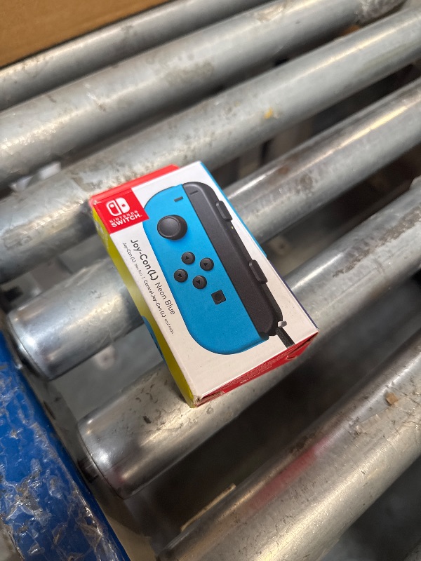 Photo 1 of ****FINAL SALE NOT RETURNS****DOESNT WORKJ****
Nintendo Joy-Con (L) - Neon Blue Switch